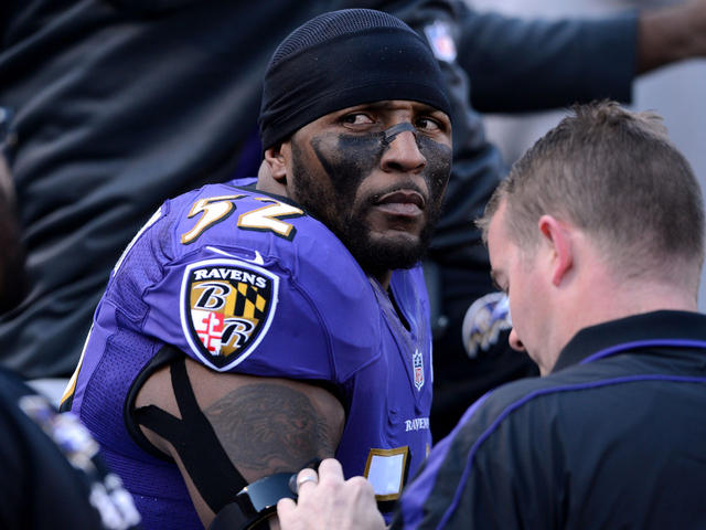 The Baltimore Ravens' Ray Lewis, left, fires up teammate Chris