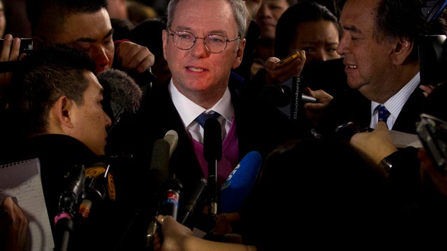 Google executive chairman Eric Schmidt, center, and former New Mexico Gov. Bill Richards, right, brief journalists after they arrived at Beijing Capital International Airport from Pyongyang, in Beijing Thursday, Jan. 10, 2013. Schmidt is urging North Kore 