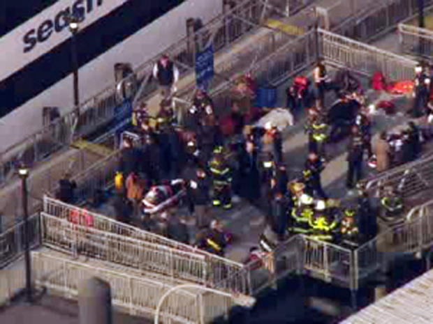 Firefighters take injured ferry passengers from a commuter ferry after a hard docking in Lower Manhattan in New York City Jan. 9, 2013. 