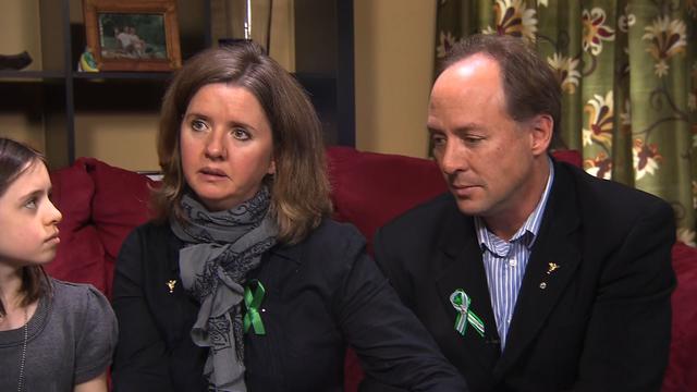 Nathalie Barden (far left) looks on as her mother, Jackie, and father, Mark, discuss their son Daniel. 