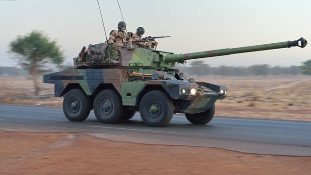 French soldiers on a Sagaie tank destroyer leave Bamako 