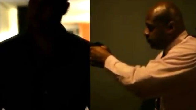 A split-screen image capture shows a silhouette of an active shooter and a law-enforcement officer in a Homeland Security video posted to YouTube. 