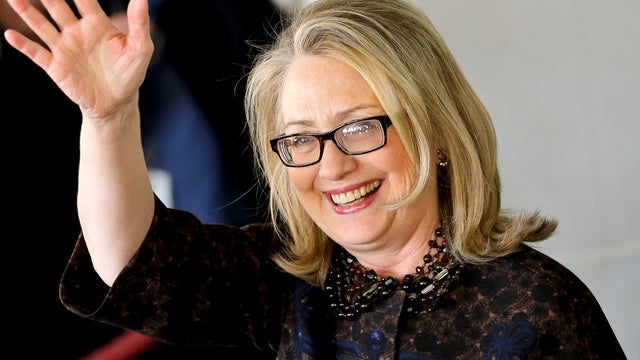 Outgoing Secretary of State Hillary Rodham Clinton waves as she leaves the State Department in Washington Feb. 1, 2013, for last time as America's top diplomat. 