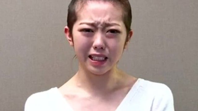Minami Minegishi cries while apologizing in video on AKB48's website. 