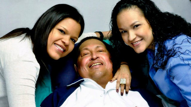 Hugo Chavez poses for a photo with his daughters, Maria Gabriela, left, and Rosa Virginia 