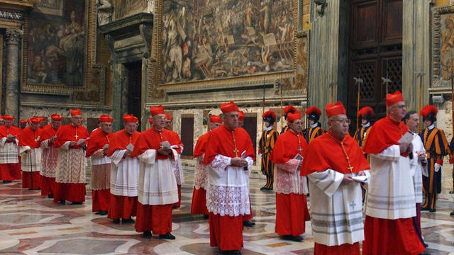 In this photo from files taken on April 18, 2005 and released by the Vatican paper L'Osservatore Romano, Cardinals walk in procession to the Sistine Chapel at the Vatican, at the beginning of the conclave.  