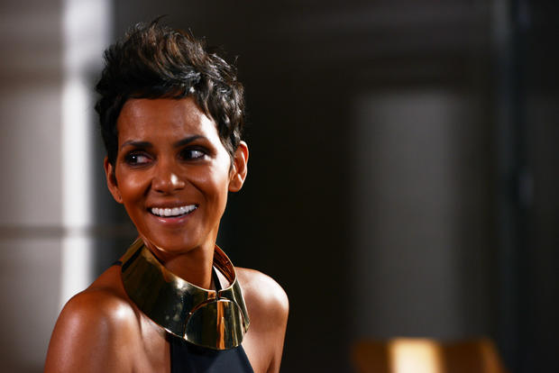 Halle Berry, still in wardrobe, smiles after shooting with Bruce Weber.  