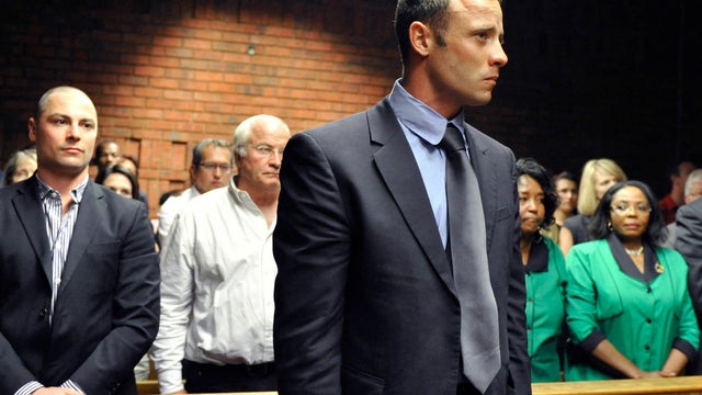 Oscar Pistorius stands following his bail hearing 