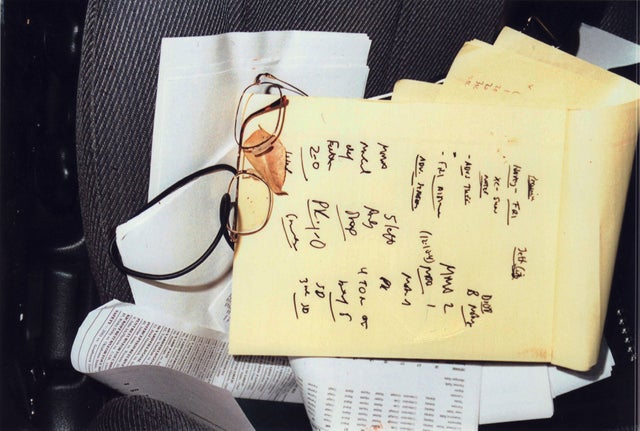 A notepad with blood smear was on the driver's side seat of Kent Heitholt's car, along with his glasses. 