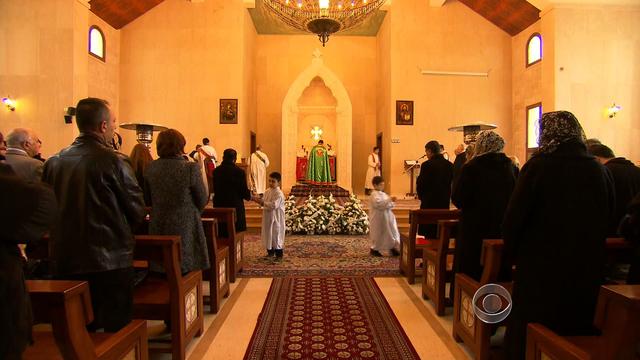 Christian Syrians pray at a church in Lebanon 