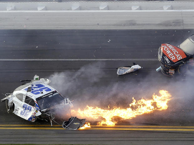 Kyle Larson, left, slides to a stop near Regan Smith (7) after a wreck at the conclusion of the NASCAR Nationwide Series auto race Feb. 23, 2013, at Daytona International Speedway in Daytona Beach, Fla. 