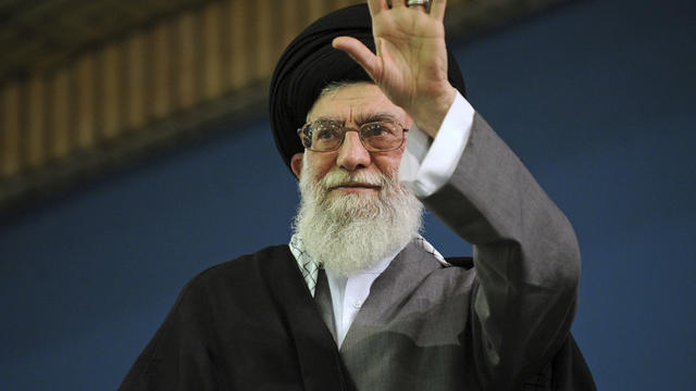 Supreme Leader Ayatollah Ali Khamenei waves to a crowd attending his speech in a mosque inside the leader's housing compound in Tehran, Iran, Feb. 16, 2013, in this picture released by the official website of the Iranian supreme leader's office. 