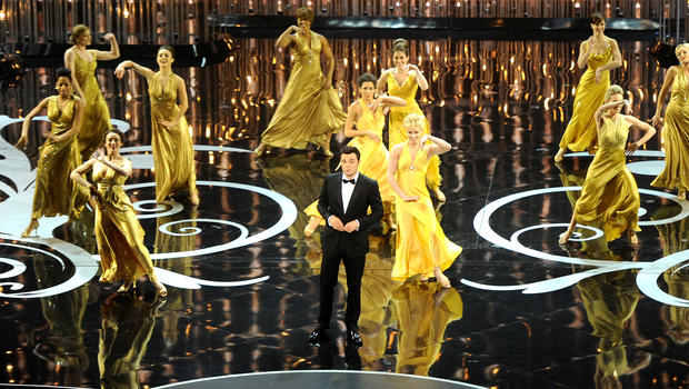 Host Seth MacFarlane speaks onstage as actors and dancers perform around him during the Oscars held at the Dolby Theatre on February 24, 2013 in Hollywood, California. 