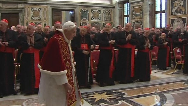 In this image taken from video as Pope Benedict XVI enters to deliver his final greetings to the assembly of cardinals at the Vatican, Thursday Feb. 28, 2013, before he retires in just a few hours.  