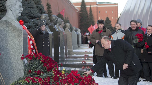Communist party leader Gennady Zyuganov places flowers on Stalin's grave in Red Square, outside the Kremlin wall to mark the 60th anniversary of his death, Moscow, Russia, Tuesday, March 5, 2013. 