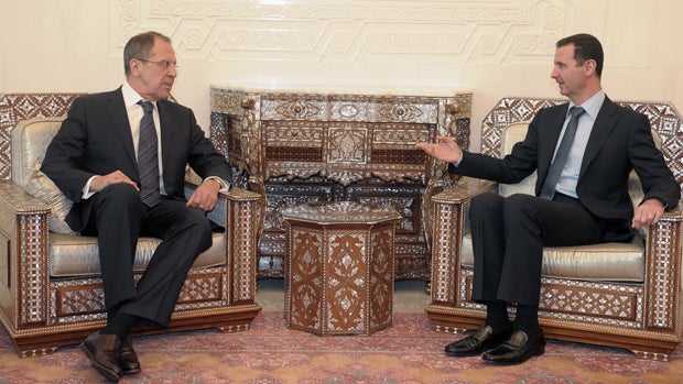 Syrian President Bashar Assad (right) speaks with visiting Russian Foreign Minister Sergei Lavrov 