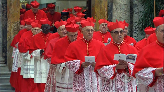 Catholic cardinal electors process into the Sistine Chapel 