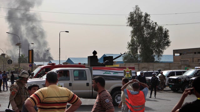 Black smoke from a car bomb attack is seen in Baghdad, Iraq, on March 14, 2013. A string of explosions tore through the center of the city central within minutes of each other.   