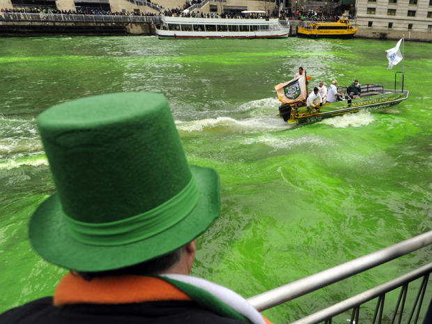 A spectator looks on as the Chicago River is dyed green ahead of the St. Patrick's Day parade in Chicago March 16, 2013. With the holiday itself falling on a Sunday, many celebrations were scheduled for Saturday because of religious observances. 