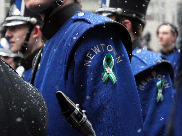 Members of the Newtown (Conn.) High School Marching Band gather after marching in the St. Patrick's Day Parade March 16, 2013, in New York. 