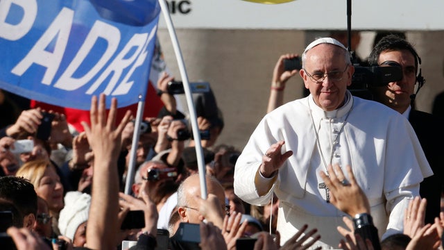 Pope Francis waves to crowds as he arrives to his inauguration Mass in St. Peter's Square at the Vatican, Tuesday, March 19, 2013. 