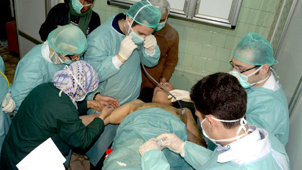 In this photo released by the Syrian official news agency SANA, a Syrian victim who suffered an alleged chemical attack at Khan al-Assal village according to SANA, receives treatment by doctors, at a hospital in Aleppo, Syria, Tuesday March 19, 2013. The U.S. has not found evidence that Syria has used chemical weapons. 