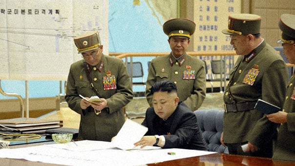 Kim Jong Un with military commanders 