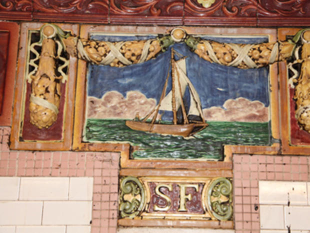 Restored historic terra cotta plaque at South Ferry Station 