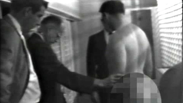 James Earl Ray, the man who assassinated Martin Luther King in 1963, is stripped search by police. 