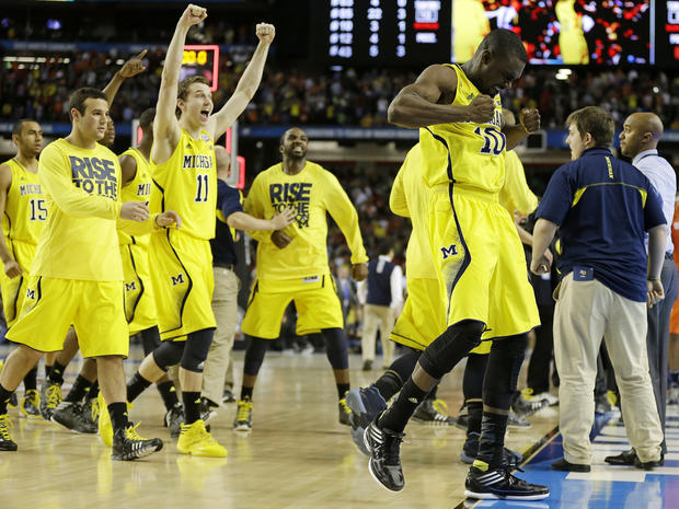 Michigan players react after the second half of a NCAA Final Four tournament college basketball semifinal game against Syracuse April 6, 2013, in Atlanta. Michigan won 61-56. 