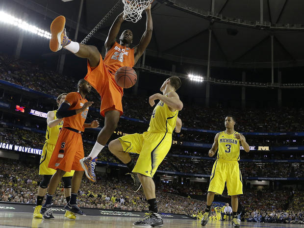 Syracuse's Rakeem Christmas (25) dunks the ball against Michigan during the second half of a NCAA Final Four tournament college basketball semifinal game April 6, 2013, in Atlanta. 