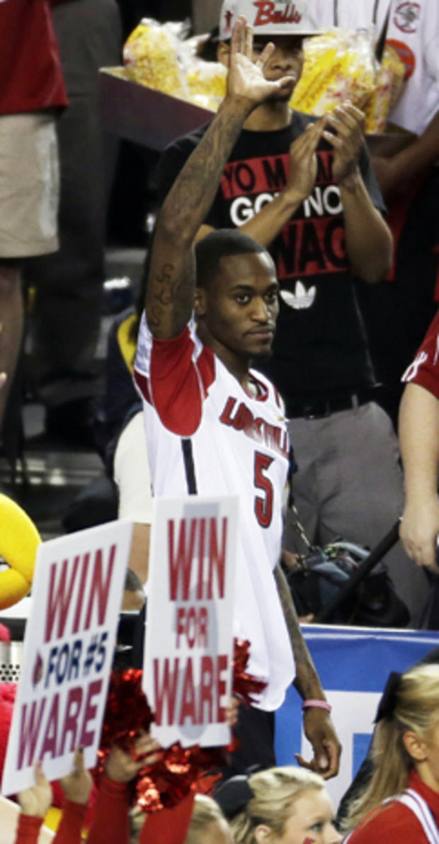 Louisville's Kevin Ware waves after the second half of a NCAA Final Four tournament college basketball semifinal game against Wichita State April 6, 2013, in Atlanta. Louisville won 72-68. 