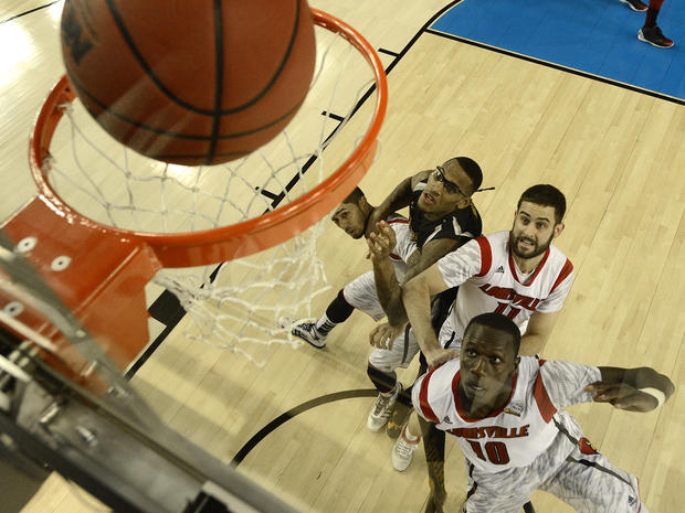 Louisville's Peyton Siva (3), Wichita State's Carl Hall (22), Louisville's Luke Hancock (11) and Louisville's Gorgui Dieng (10) wait for a rebound during the second half of a NCAA Final Four tournament college basketball semifinal game April 6, 2013, in A 