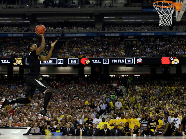Wichita State's Cleanthony Early (11) heads to the hoop against Louisville during the second half of a NCAA Final Four tournament college basketball semifinal game April 6, 2013, in Atlanta. 