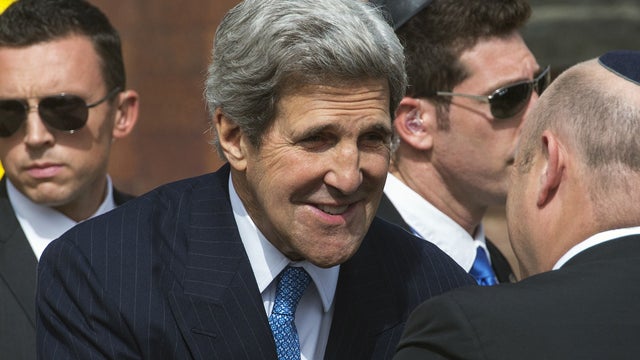 U.S. Secretary of State John Kerry, center, greets officials shortly before placing a wreath from the United States at the Yad Vashem memorial in Jerusalem during Holocaust Remembrance Day on Monday, April 8, 2013. Holocaust memorial day is one of the mos 