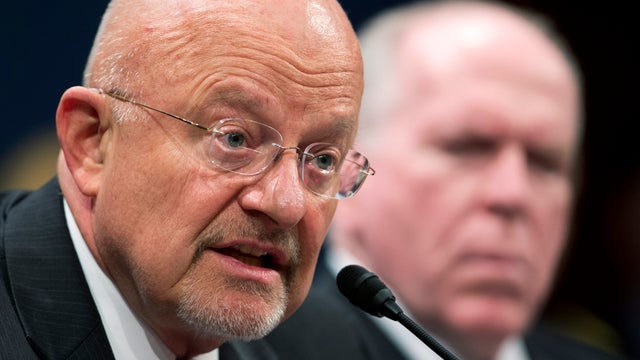 National Intelligence Director James Clapper, left, accompanied by CIA Director John Brennan, testifies on Capitol Hill in Washington April 11, 2013, before the House Intelligence Committee hearing on worldwide threats. 