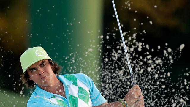 Rickie Fowler hits out of a bunker to the 18th hole during the second round of the Masters golf tournament April 12, 2013, in Augusta, Ga. 