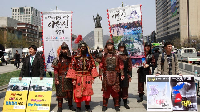 South Korean protesters with college students, wearing medieval Korean military uniforms, stage a protest against the annual South Korea-U.S. joint military exercise 