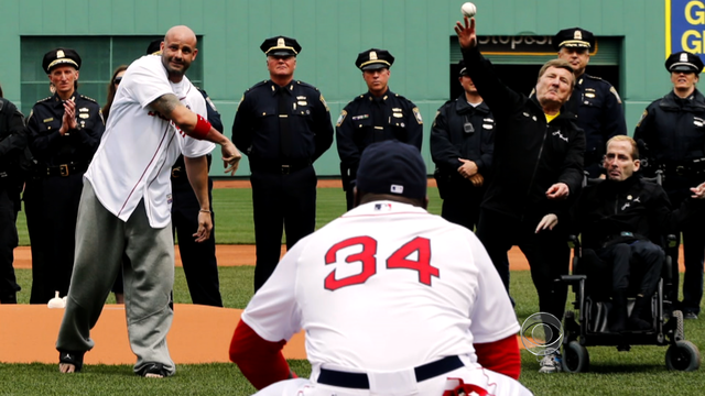 Marathon victim throws first pitch as Boston slowly heals