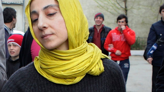 Zubeidat Tsarnaeva, mother of Tamerlan and Dzhokhar Tsarnaev, the two men accused of setting off bombs near the Boston Marathon finish line, walks near her home in Makhachkala, Dagestan, Russia, April 23, 2013. 