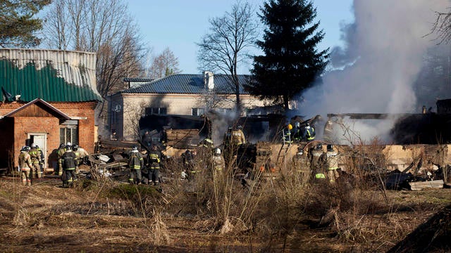 Ministry for Emergency Situations workers and firefighters work at site of fire in psychiatric hospital outside Moscow April 26, 2013 