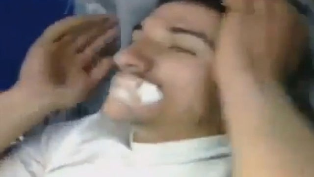 An image from a video posted on YouTube by Syrian opposition activists shows a man allegedly suffering symptoms of a chemical weapons attack 