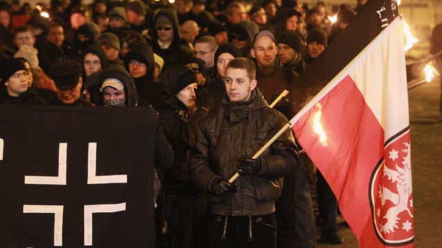 Neo-Nazis and their sympathizers march with torches to commemorate the World War II firebombing of Dresden by Allied planes on February 13, 2012 in Dresden, Germany. Civil rights activists sought to surround the expected 1,500 neo-Nazis with a human chain 
