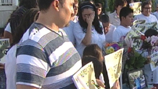 Family and friends of Ricardo Portillo hold vigil for him on front lawn of his Utah home on May 5, 2013 after soccer ref in rec league died from injuries suffered when he was  punched in head by angry teen goalie  