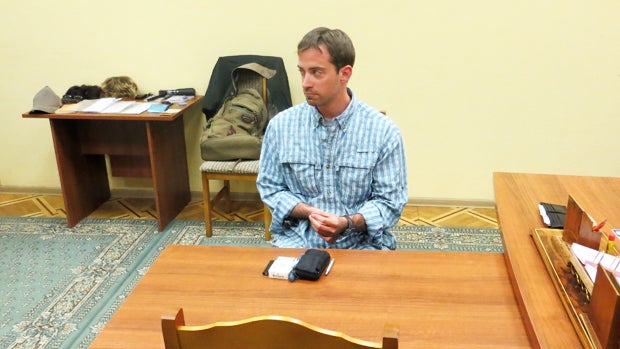 In this handout photo provided by the FSB, acronym for Russian Federal Security Service, a man claimed by FSB to be Ryan Fogle, a third secretary at the U.S. Embassy in Moscow, sits in the FSB offices in Moscow, early Tuesday, May 14, 2013. Russia's secur 