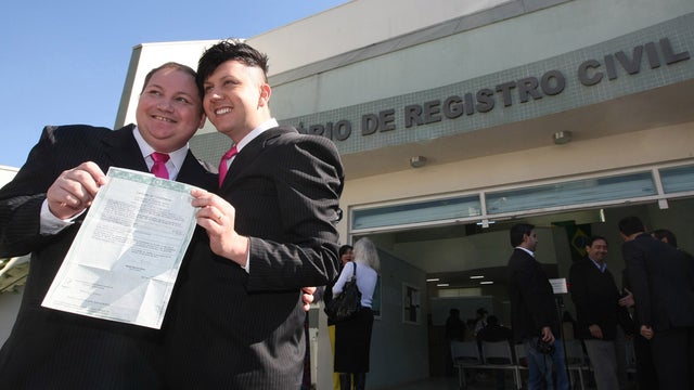 Homosexual couple Jose Sergio Sousa Moresi (R) and Luiz Andre Sousa Moresi get married at a civil registry office in Jacarei, in southeastern Brazil, on June 28, 2011. This was the first gay marriage in Brazil after a Court allowed their legal union. 