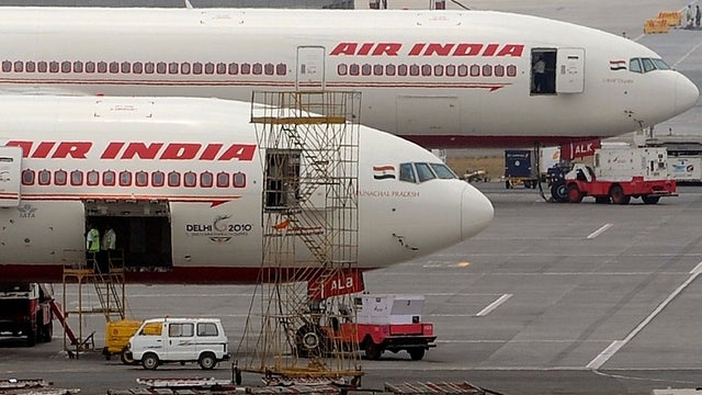 Air India aircraft are parked on the tarmac of the international airport in Mumbai, India, April 29, 2011. 