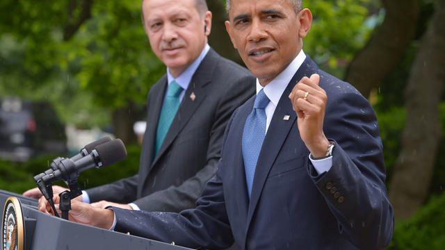 President Obama and Turkish Prime Minister Recep Tayyip Erdogan conduct a joint press conference during a rain shower in the Rose Garden of the White House May 16, 2013, in Washington. 