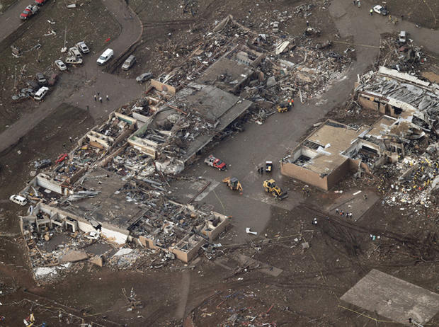 This aerial photo shows damage to Plaza Towers Elementary School after it was hit by a massive tornado in Moore, Okla., Monday May 20, 2013. 