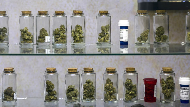 In this photo taken Tuesday, May 14, 2013, Medical marijuana vials are displayed at the Venice Beach Care Center medical marijuana dispensary in Venice, Calif. Los Angeles politicians have tried and failed for so long to regulate medical marijuana that it 
